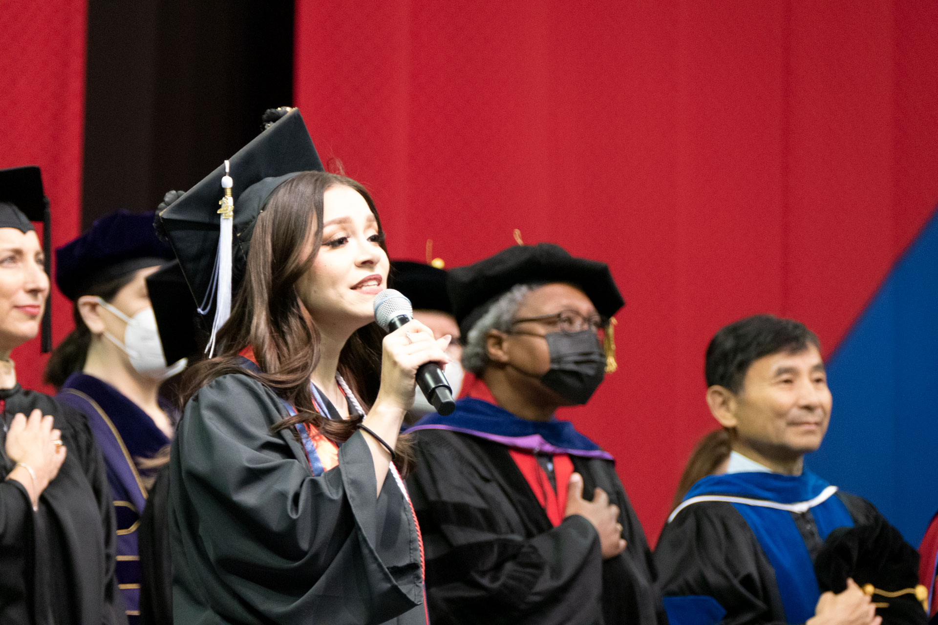 Zoey Turney, graduate in the Department of Music, sings the National Anthem.
