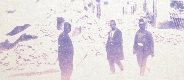 Image of the The Horrors of Adana: Revolution and Violence in the Early Twentieth Century book cover. In a faded black and white image, three people look at the camera in front of a pile of debris.