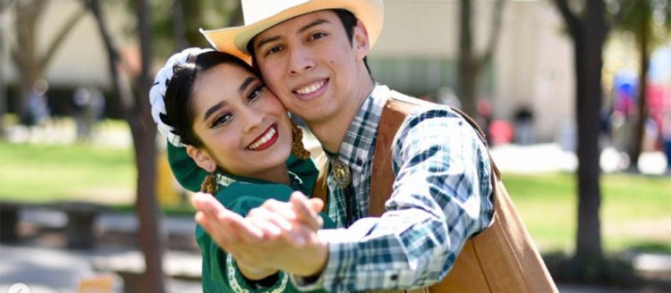 Two folkórico dancers from Fresno State's Los Danzantes De Aztlán dance program.